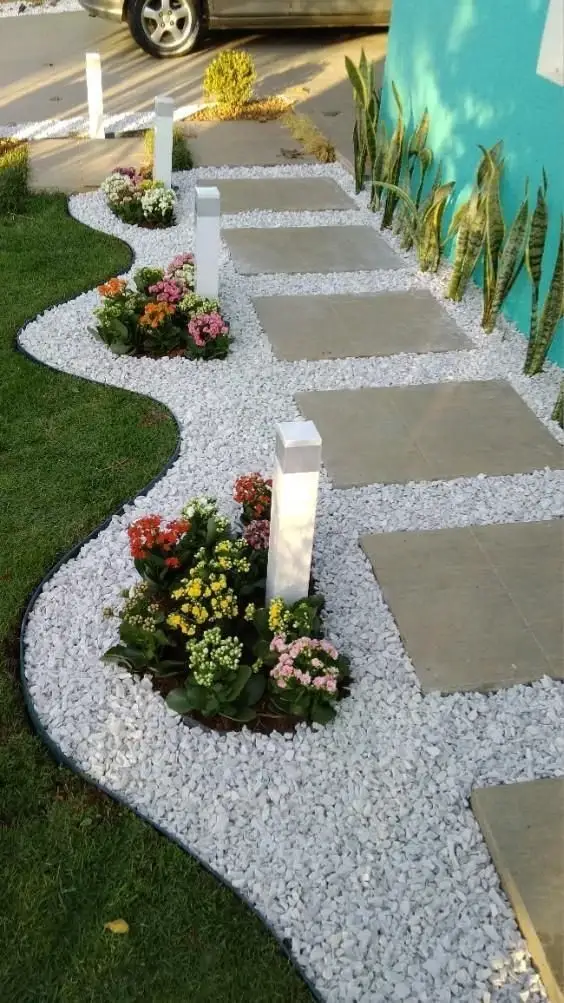 Gravel pathway with flowers and lights, Dubai